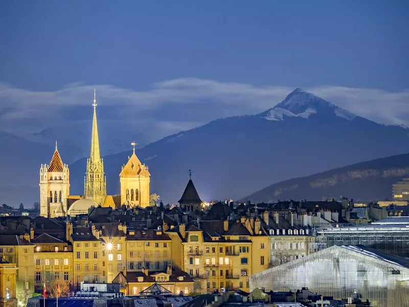 Downtown Geneva, beneath snowy mountains