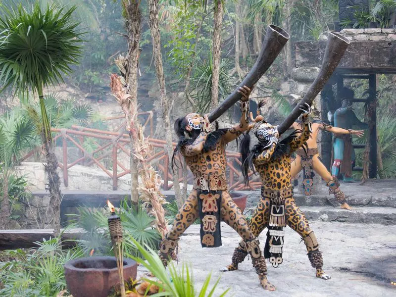 Young men dressed in mayan costume