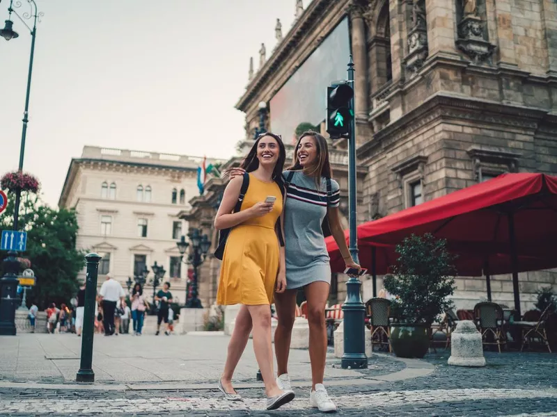 Young women in Budapest crossing the street