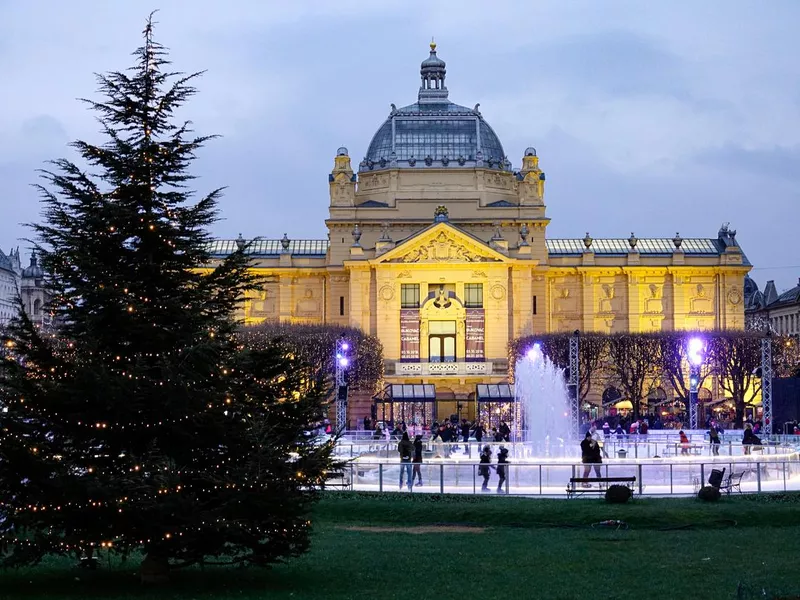 Children and adults visit the beautiful Christmas village in Zagreb, Croatia