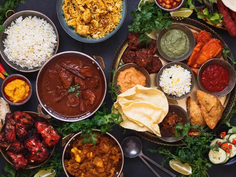 Various Indian dishes naan and dips