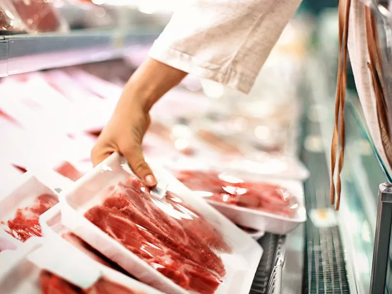 Buying meat at a supermarket