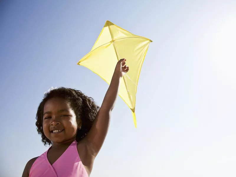 Girl flying a kite