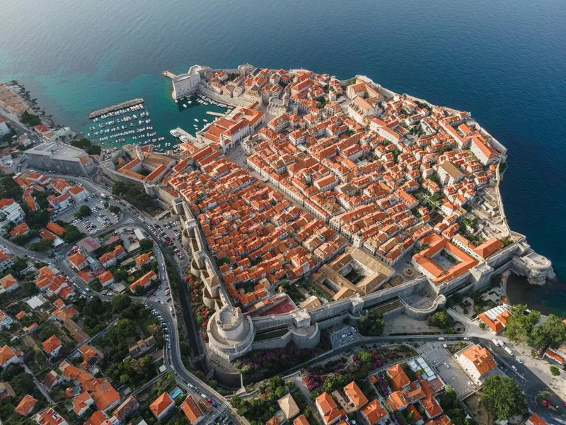 Dubrovnik, Croatia. Aerial view of the old town with rooftops and Adriatic sea.. Top view from drone