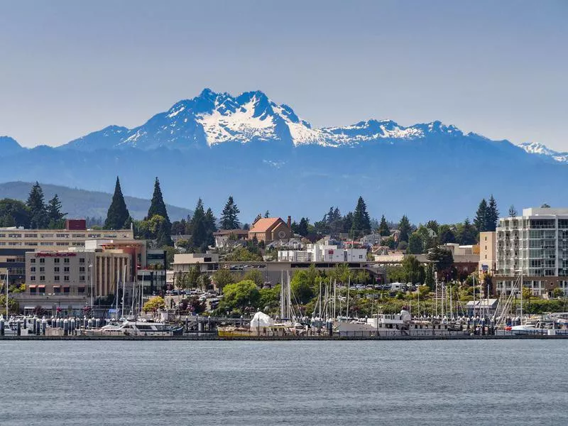 Waterfront of Bremerton, WA, with snow capped mountains in the background