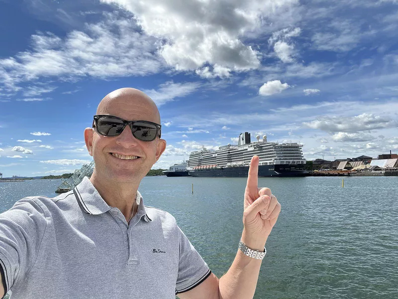 Passenger in front of Holland America ship in Oslo