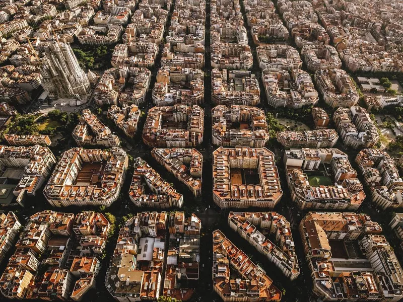 Aerial view of the residential Eixample district of Barcelona, with the Sagrada Familia, Designed by Catalan architect Antoni Gaudi