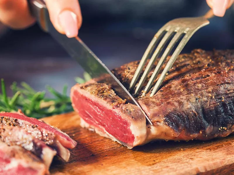 Cutting Juicy Beef Steak