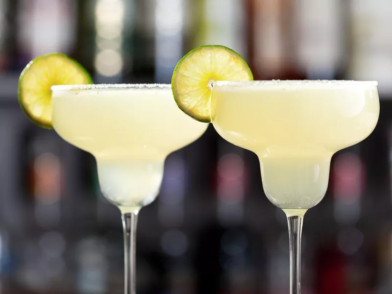 Two margaritas in salted glasses