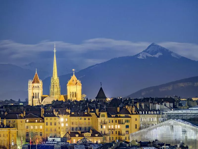 Downtown Geneva, beneath snowy mountains