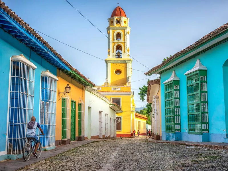 unrecognisable cuban man riding a bike in Trinidad, Cuba