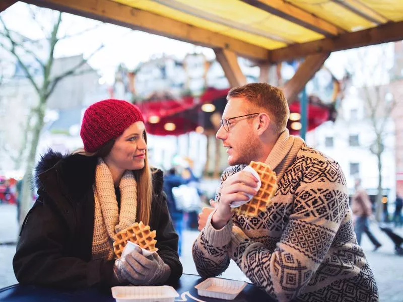 People eating waffles in Belgium