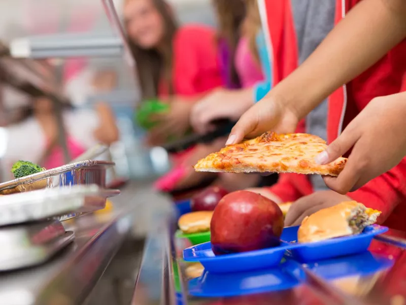 School children getting pizza