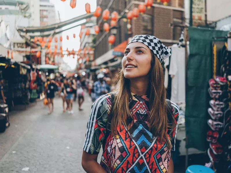 Female tourist on the old market street