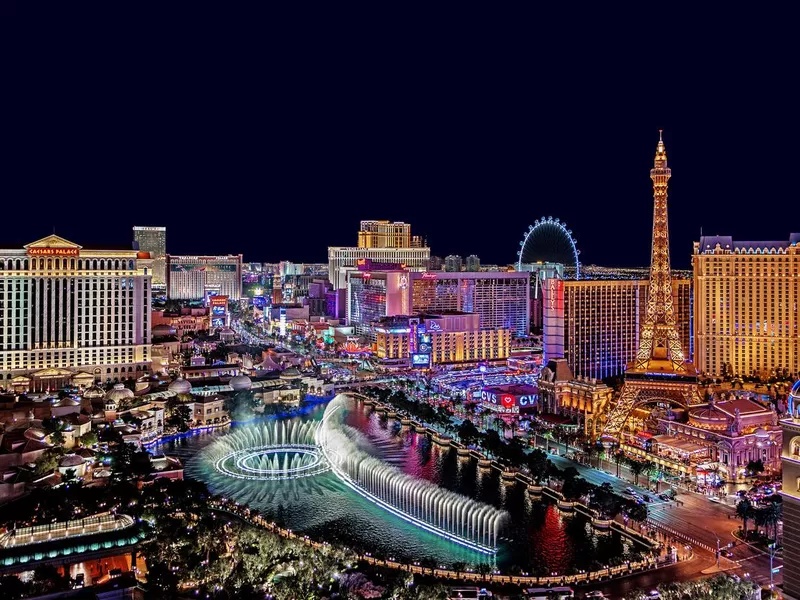 The famous Las Vegas Strip with the Bellagio Fountain. The Strip is home to the largest hotels and casinos in the world.