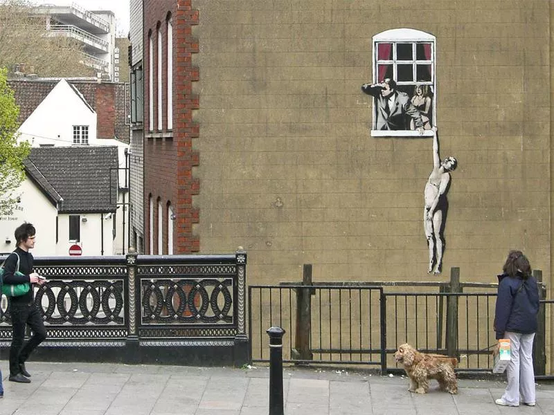 ‘Naked Man Hanging from Window’