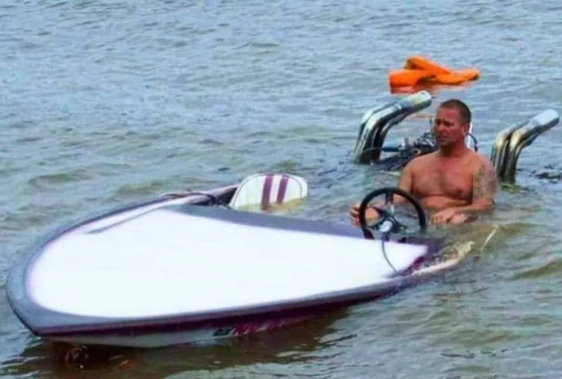 Man driving a sinking boat