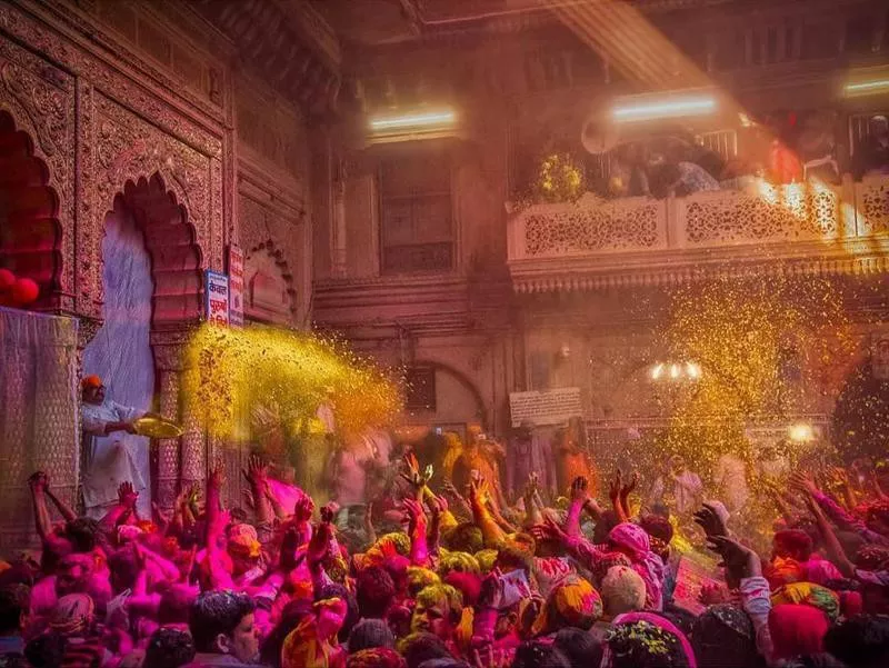 People celebrating Holi in a temple