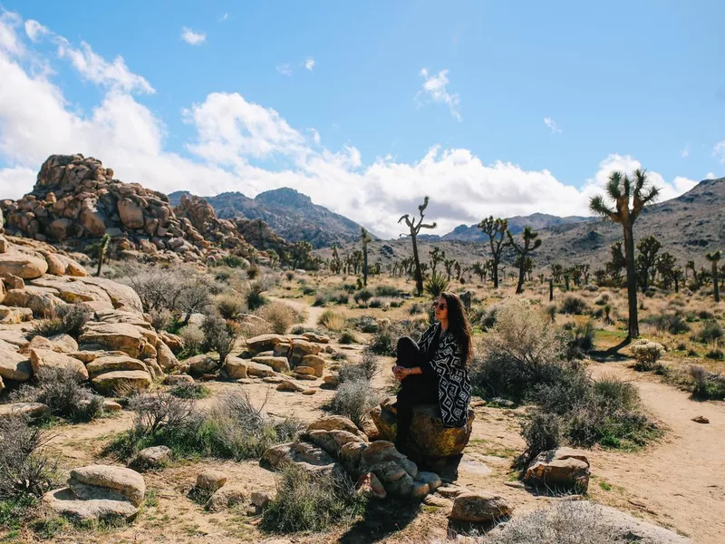 woman traveler in Mojave desert, Joshua Tree, California