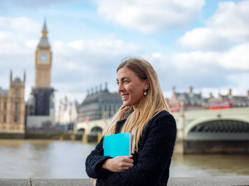 Happy female student in London