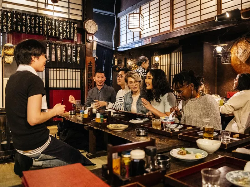 Tourists in Japanese Izakaya