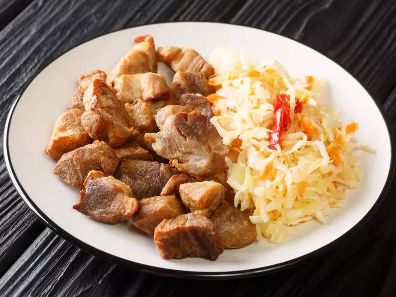 Haitian griot with salad