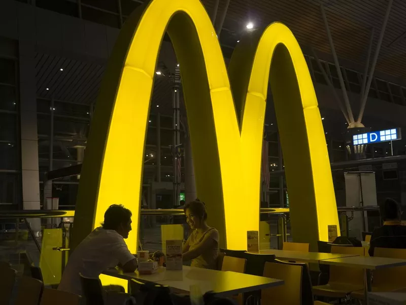 Couple eating in McDonalds restaurant