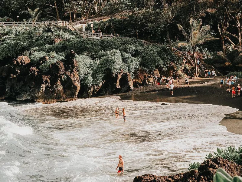 People in the Water at Honokalani Beach