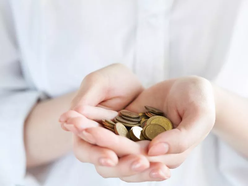 Woman holding coins