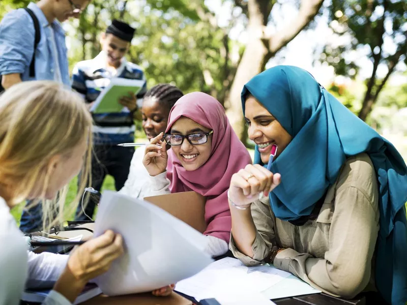 Diverse children studying outdoor