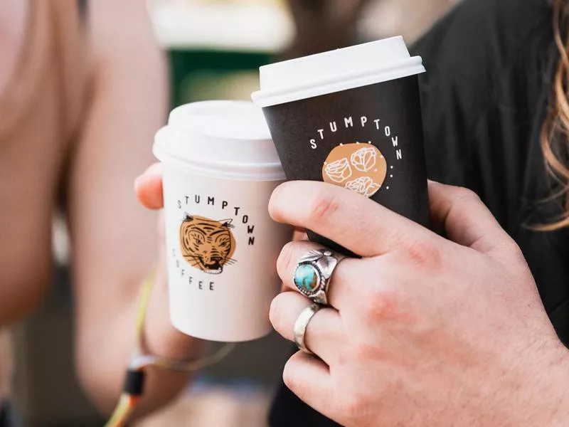 Friends cheering with coffee