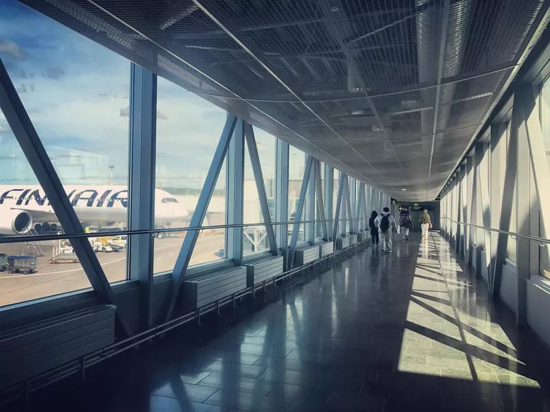 Passengers walking through the airport gate in Finland