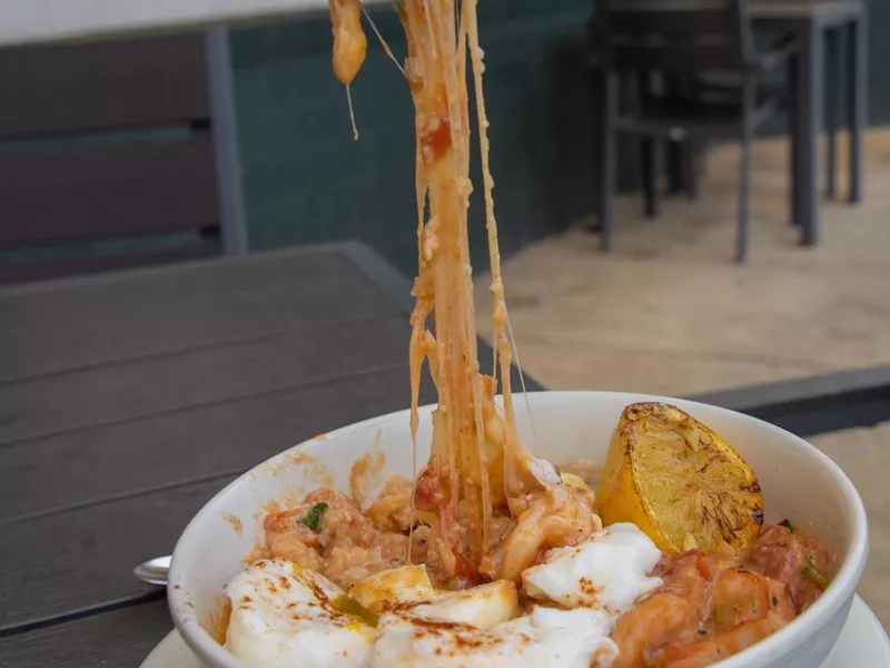 Shrimp and grits bowl at Eggs Up Grill