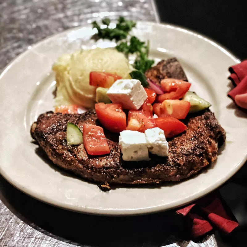 Steak with mashed potatoes at Barbarie’s Black Angus Grill