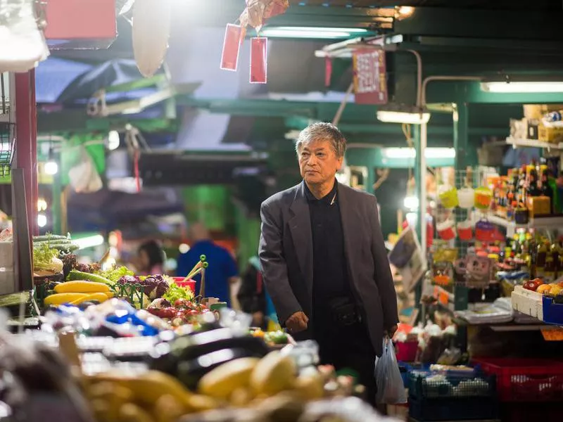 Senior man shopping in Hong Kong