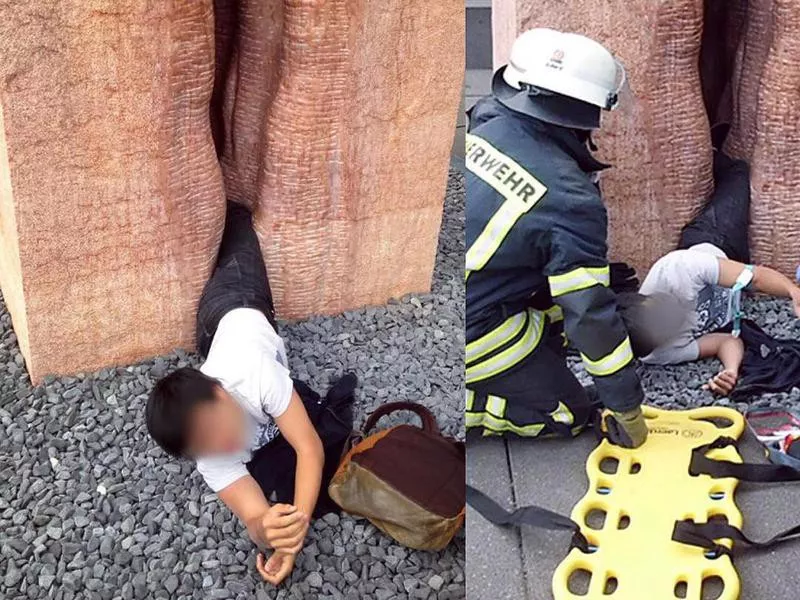 Tourist stuck inside a sculpture