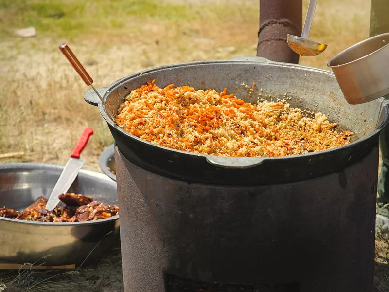 Cooking traditional Uzbeki plov