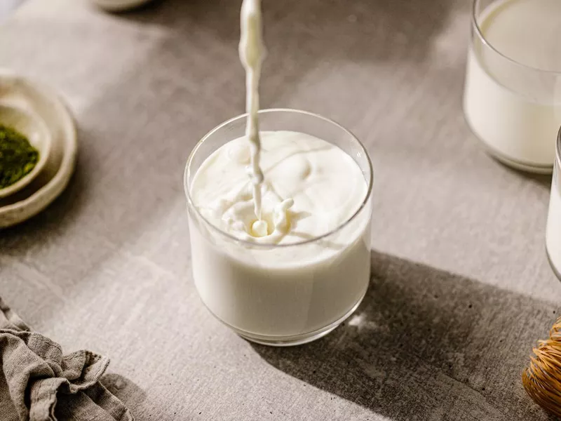 Pouring fresh milk in glass