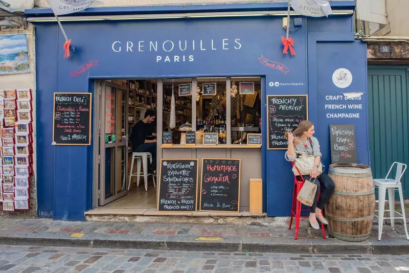 Woman taking a break at a cafe in Montmartre, France