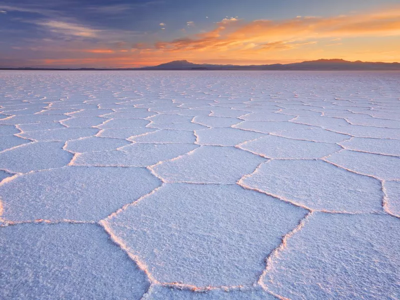 Salt flat Salar de Uyuni in Bolivia at sunrise