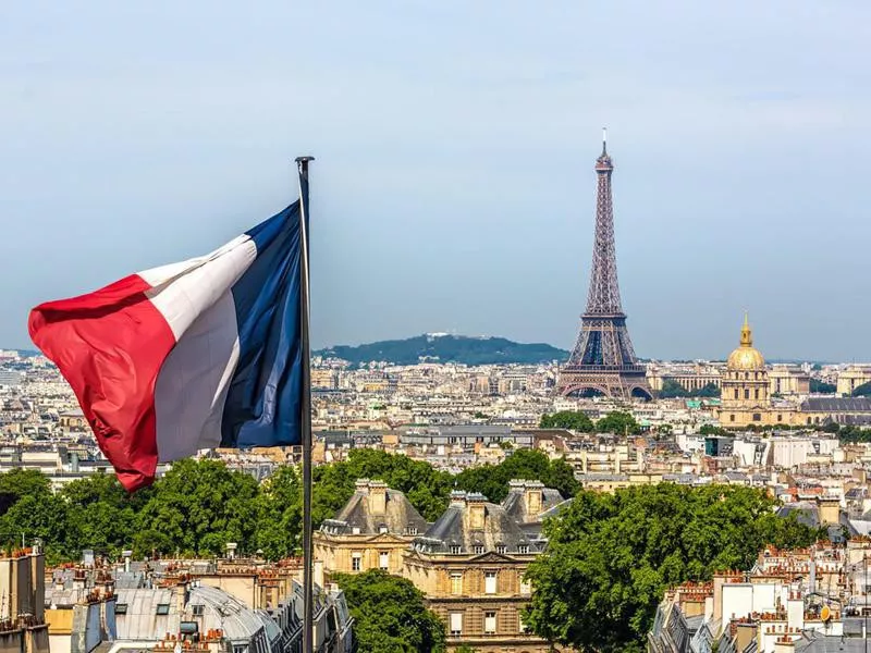 Skyline Paris with Eiffel Tower and French flag