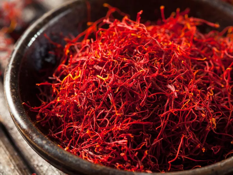 Raw red saffron in a bowl