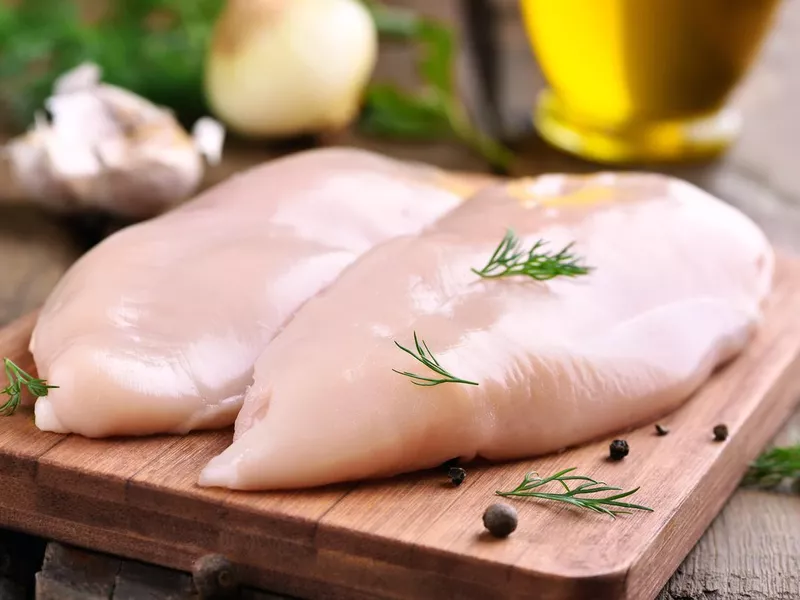 Chicken breasts on cutting board