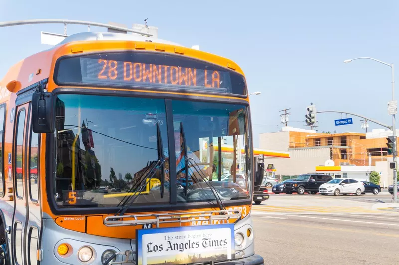 Bus approaching station and stop in Olympic Boulevard in Beverly Hills.