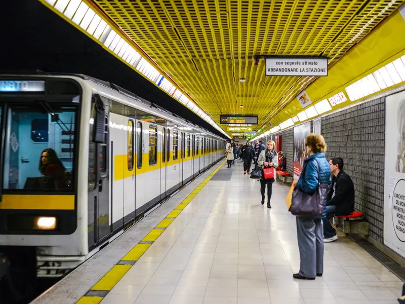 People waiting for a train in Milan subway station