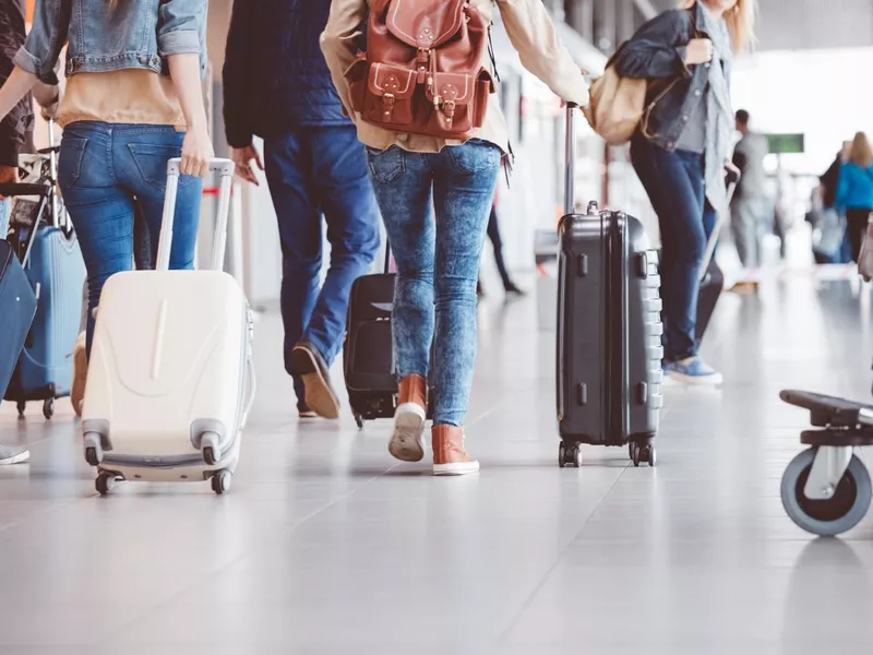 Passengers walking in the airport terminal