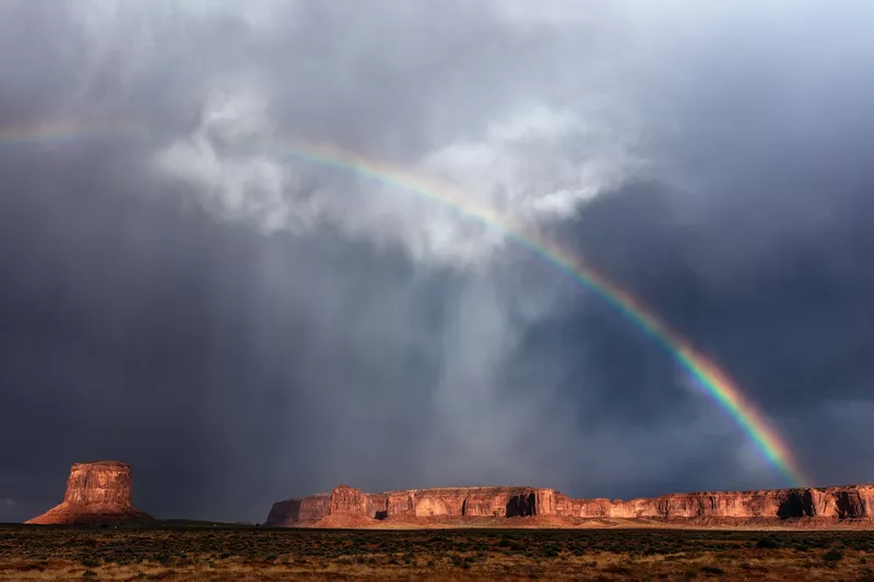 Storm and rainbow over Monument Valley