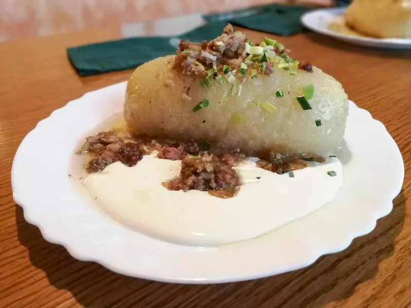 Traditional Lithuanian food called Cepelinai in the white plate