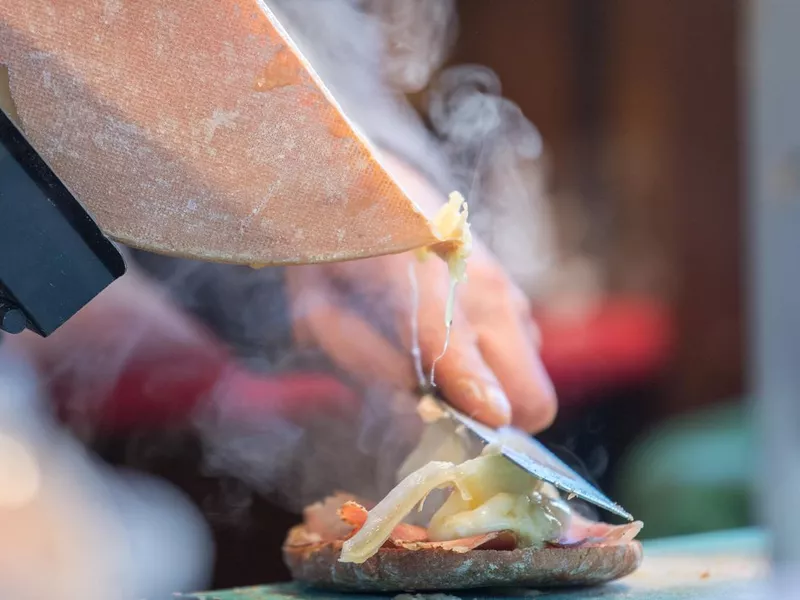 Traditional raclette swiss and french cheese