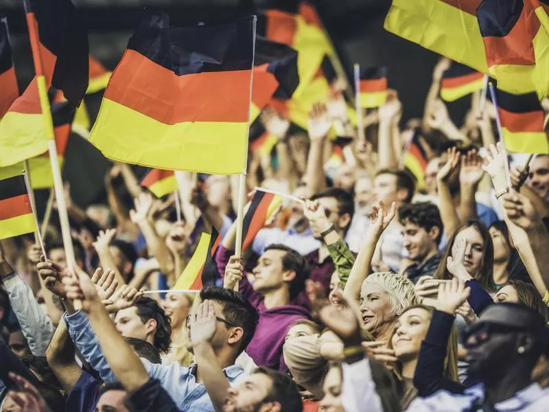 Germany supporters waving their flags on a stadium